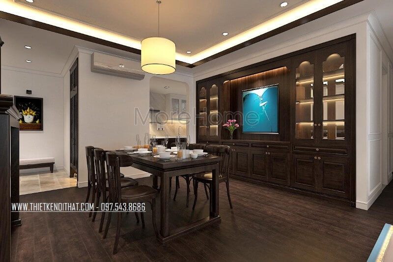 Thiết kế nội thất phòng ăn chung cư theo phong cách gỗ Việt truyền thống, hệ thống tủ gỗ thiết kế âm tường mang đến tính tiện dụng trong sử dụng và góp phần tạo sự sang trọng cho không gian